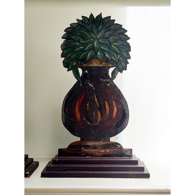 A pair of matching dummy board urns with foliage. The exact date of creation is unknown, but I believe these to be...