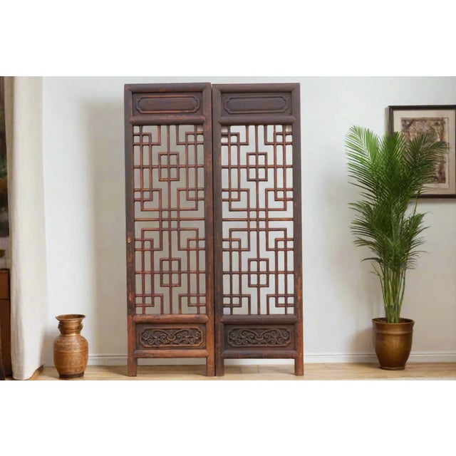 These captivating antique Shanxi lattice doors are over 6’ feet tall and hand-crafted in 18th century China. Their...