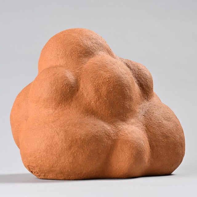 Free-form ceramic sculpture created in the 1970s. The rounded volume, composed of soft, solid forms, evokes a pebble or a...