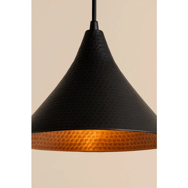Add a touch of vintage artistry to your space with this stunning Copper Black Patina Pendant Light. Featuring a wide shade...