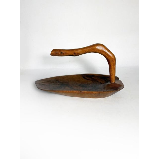 Olive wood fruit basket, France, 1950s, with a sculptural and handcrafted design. Made from a single piece of wood, this...