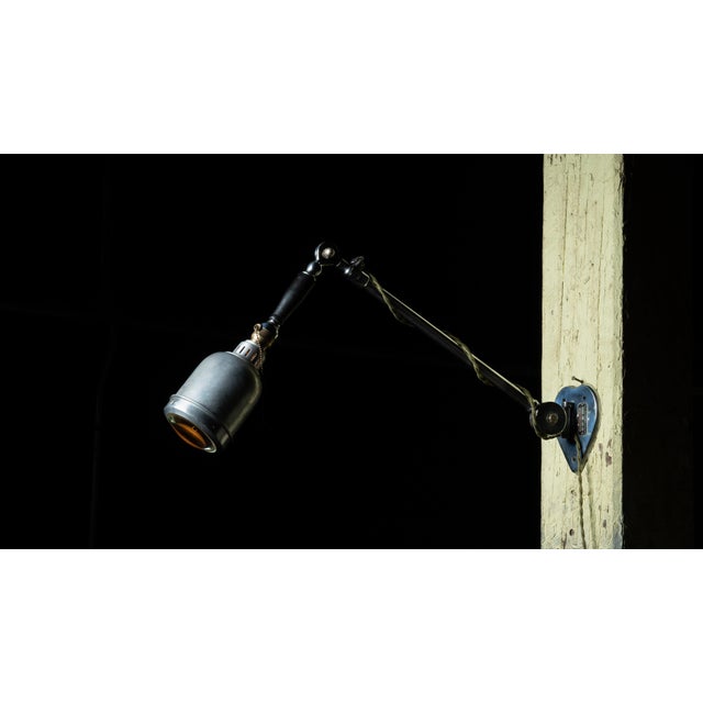 c. 1900s; The Prometheus Electric Co. - New York Antique adjustable and articulating steel dental lamp. This piece...