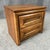 This Mid-Century oak nightstand features two drawers with bold sculpted fronts and a warm, natural wood finish. Its...