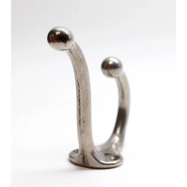 Nickel plated steel wall hook. This was acquired from the Waldorf Astoria Hotel on Park Avenue in New York City. The...