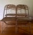 Antique French wrought iron folding garden chairs from the 19th century, featuring a twisted backrest design and wooden...