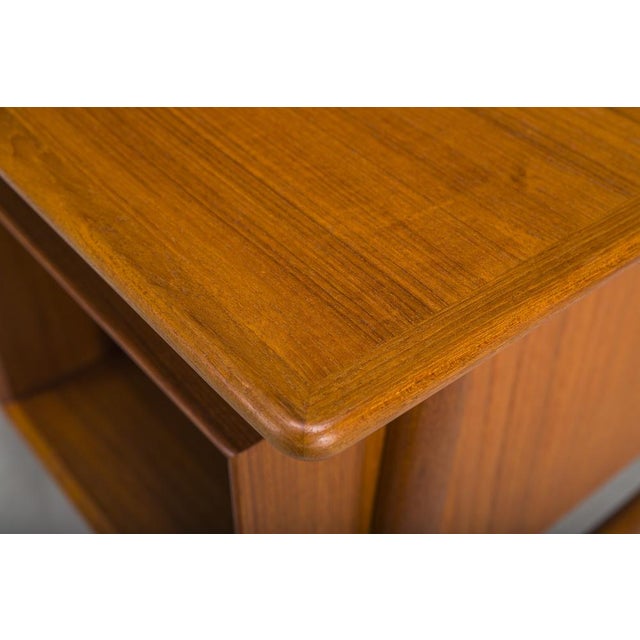 A stunning example of mid-century modern design and exceptional craftsmanship, this desk, likely designed by Omann Jun,...