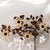 A large vintage Italian gilt-tole wall sconce composed as a radiant spray of sunflowers, leaves and illuminated flower...