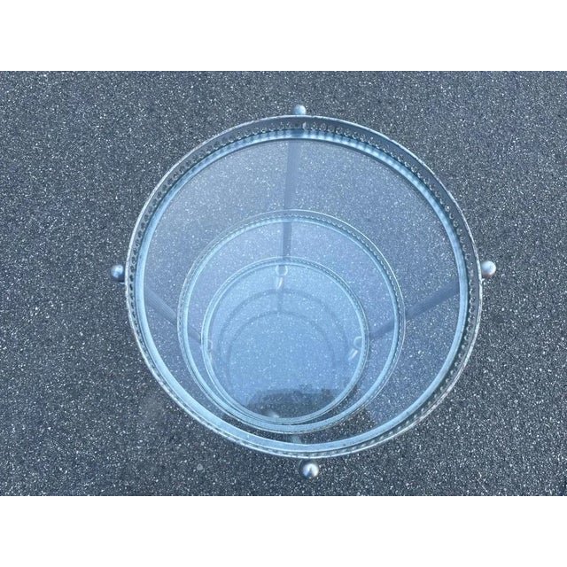 Introducing a timeless treasure from 20th Century France - the Metal and Glass Bar Cart that epitomizes the essence of Art...