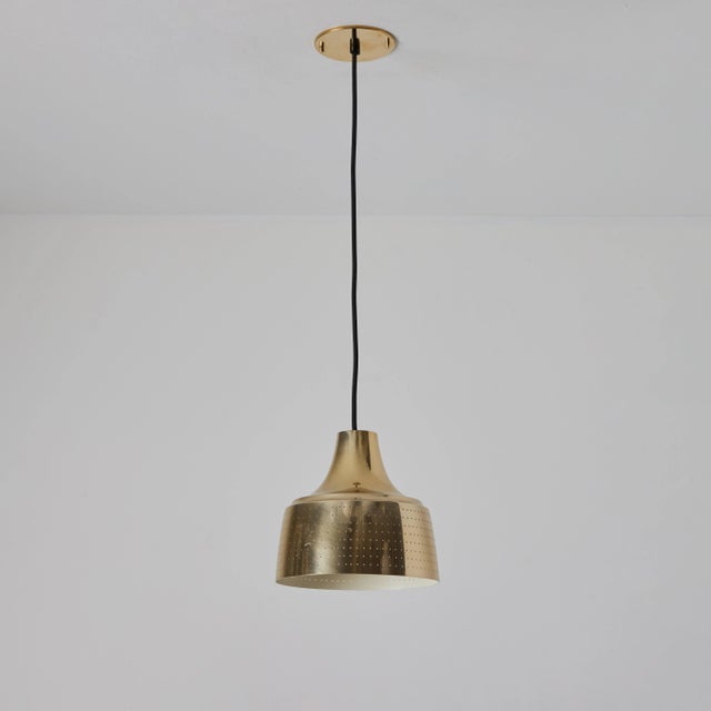 1950s Carl Thore Perforated Brassed Metal Pendant Executed in perforated brassed metal with an attractive patina, this...