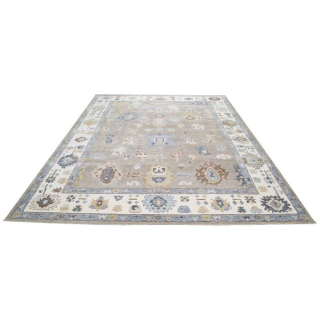 Transitional Turkish Oushak hand knotted wool rug with natural colors.