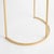 A simple mix ofWhite marble and brass creates a sophisticated look. A petite design, with a demilune silhouette, this...