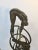 Modern cast iron Brutalist style sculpture of divers on rings sculpture on marble stand. Captured in mid-dive in cast...