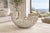 A striking large-scale sculptural centerpiece bowl featuring an intricate openwork composition of layered circular metal...