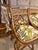 A pair of vintage bamboo counter stools with quiet colonial confidence. The cross-back silhouette and carved reed...