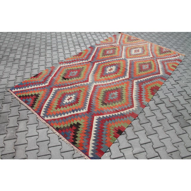 This beautiful, vintage, handwoven Kilim is approximately 60 years old. It is handmade of very fine quality, hand-spun...