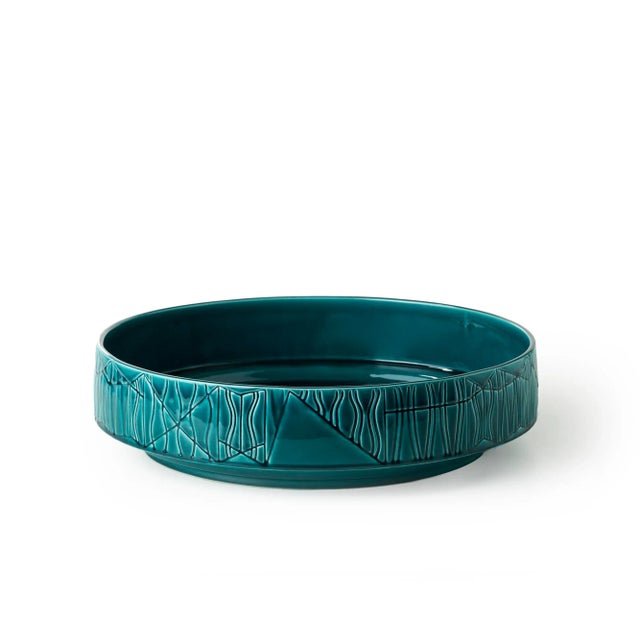 This bowl was crafted in white earth and features a bright green glaze. The collection is comprised of unique pieces made...