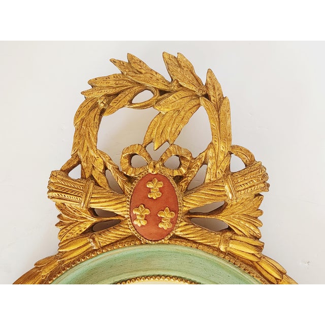 Carver's Guild stunning and unique mirror designed by Carol Canner. The heraldic arms of the French king are emblazoned in...