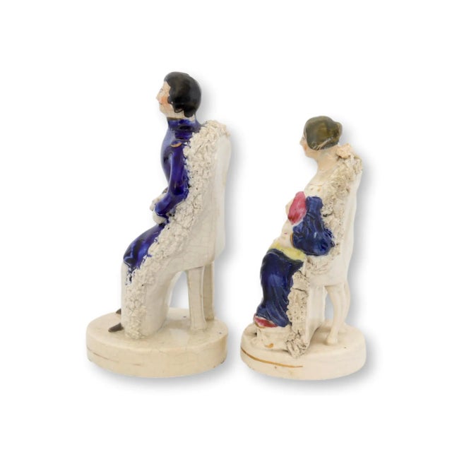 Embrace the regal charm of Staffordshire craftsmanship with this exquisite pair of porcelain figures, representing Prince...