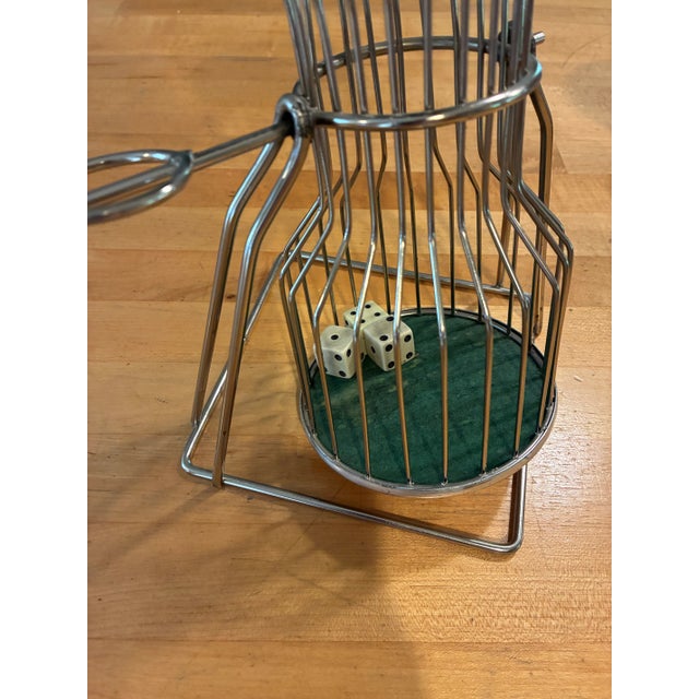 Vintage 1940's dice game Chuck A Luck. The birdcage spins and the three dice land randomly. The game is made of metal with...