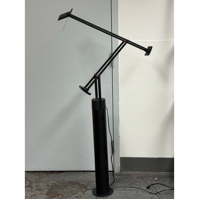Design Plus Gallery presents the Tizio Terra Floor Lamp by Richard Sapper for Artemide. This black floor lamp showcases...