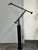 Design Plus Gallery presents the Tizio Terra Floor Lamp by Richard Sapper for Artemide. This black floor lamp showcases...