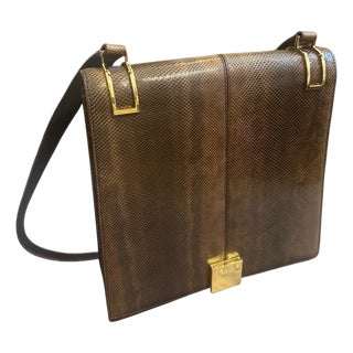 1990s Elegant High Quality Brown Leather and Brass Shoulder Bag by Celine Paris For Sale