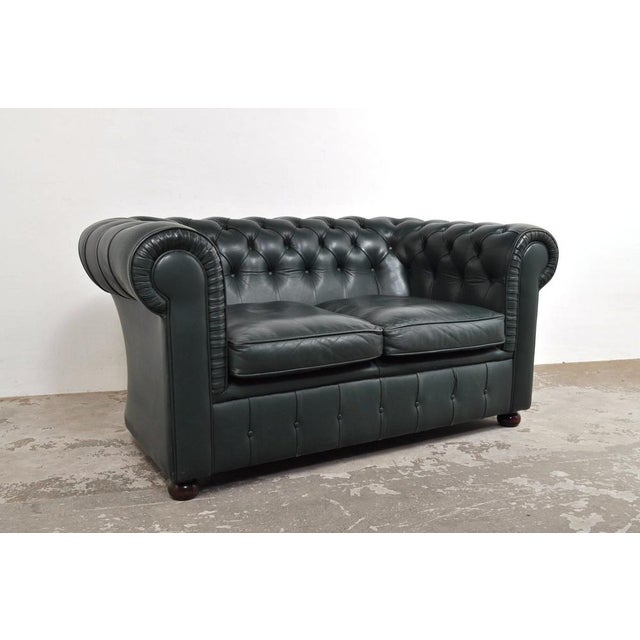 The sofa has a super cool vintage look. Beautiful color that you don't see often! The compact sofa is in good condition...