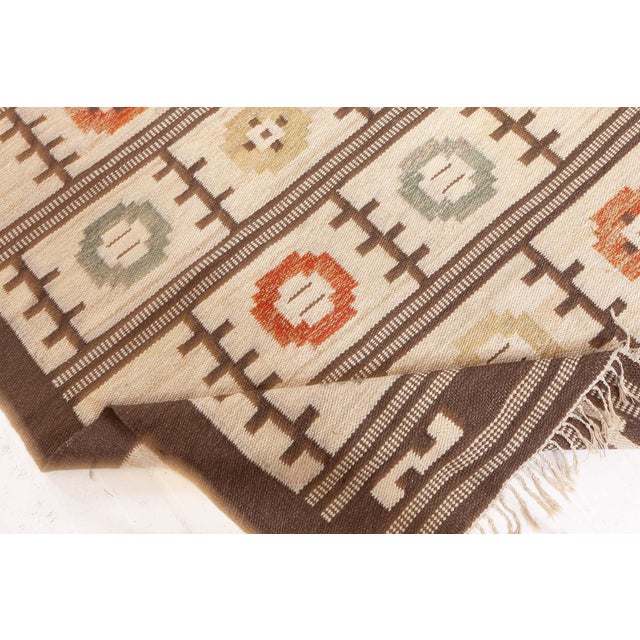 Vintage Swedish Flat Woven Rug Size: 5'0" × 8'1" (152 × 246 cm) This vintage Swedish flat-woven rug, dating back to...