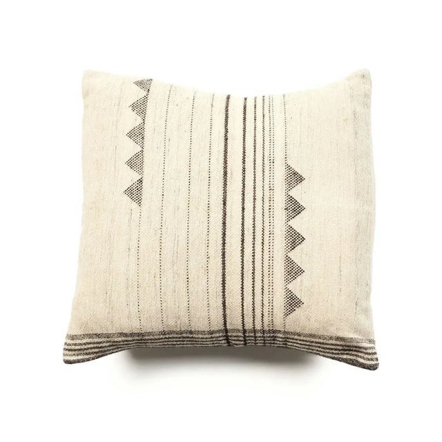 Kora Pillow is a slightly textured handwoven pillow where our artisans have skillfully blended handspun yarns like silk,...
