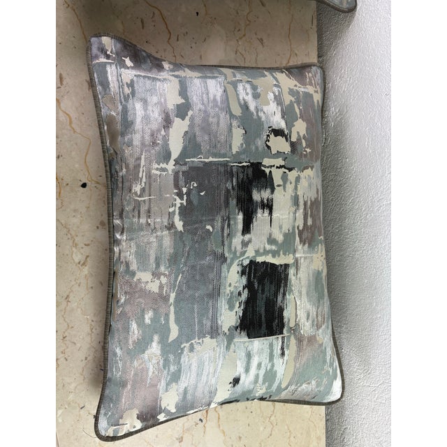 This is a pair of modern abstract silk brocade pillows. These pillows have beautiful tones of gray, dark blue, cream and...
