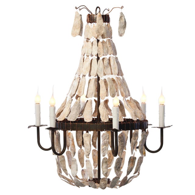 The Small Empire has natural oyster shells gathered off the Georgia coast. The handcrafted steel frame is available in a...