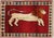 Hand-knotted Persian Gabbeh wool rug featuring a stylized lion motif on a red field, framed by a border of small...