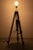 Floor lamp surveyor tripod with leather details. This old tripod has been transformed into a lamp which is adjustable in...