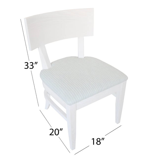 The Cole Dining Chair with upholstered seat combines refined craftsmanship with enhanced comfort, showcasing the clean...