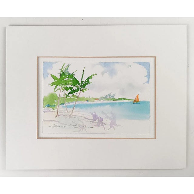Small contemporary watercolor on paper painting of coastal scene with palm trees and sailboat. Signed illegibly lower...