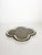 Decorative ceramic dish featuring an elegant quatrefoil (clover-shaped) silhouette with a soft cecidon-green glazed border...