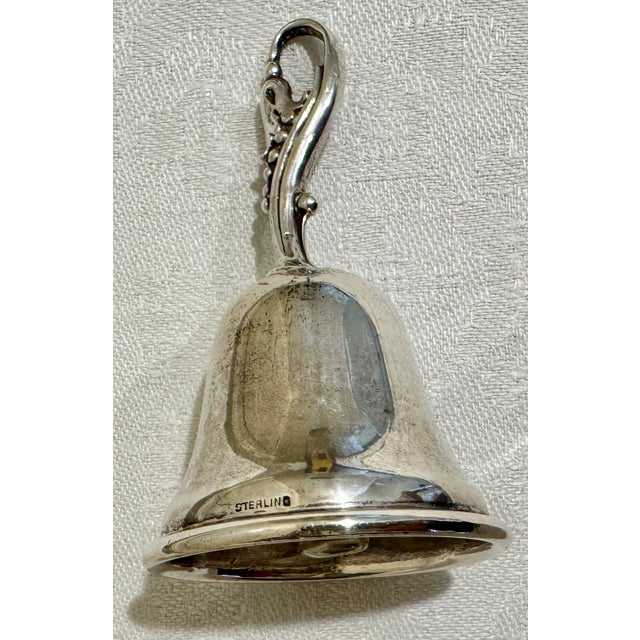 Beautiful sterling table bell from the 1950's. Excellent vintage condition. Measures approximately 3" high X 1 5/8" in...