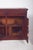 Sideboard with two different doors. In dark wood with richly detailed carvings on the front doors. Two large lower doors...
