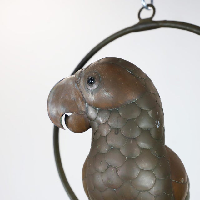 Copper, brass and aluminium Parrot on a hoop hanging stand by Sergio Bustamante, circa 1960. Sergio Bustamante is a...
