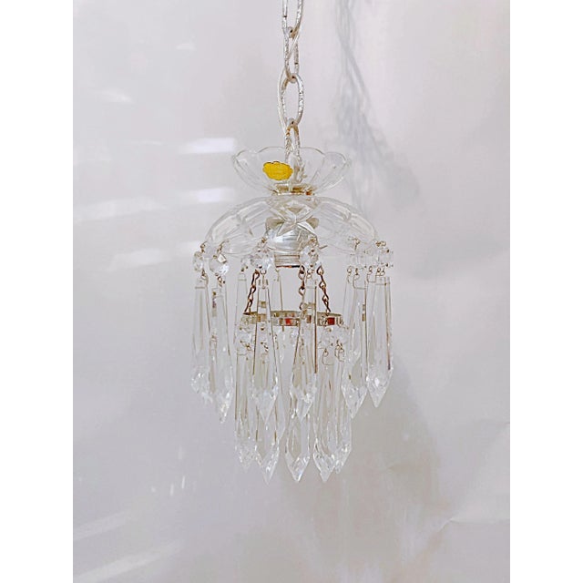 This is a dome layered chandelier with cut glass dish, octagon chain and 30% leaded U-drop crystal drops. It has 1 Edison...