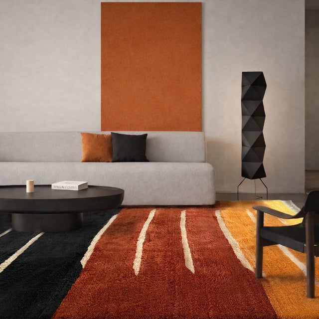 Warm bands of saffron yellow melt into rust brown and deep midnight black, each field separated by a crisp ivory line in...