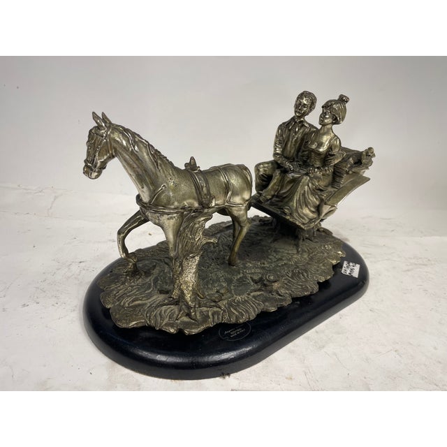 Beautiful silver laimanto pewter sculpture depicting a carriage with horses. Made in Italy from the 70s. Excellent...