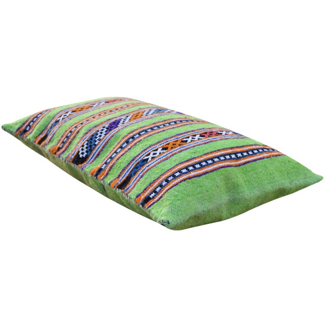 Handwoven pillow made of soft, organic wool by the Berber tribe in the Middle Atlas Mountains of Morocco. Features an...
