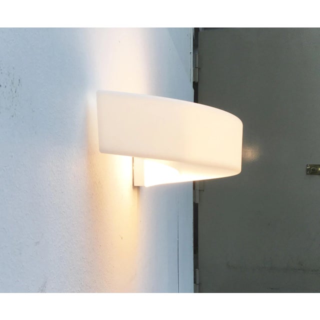 Wall lamp from the Saturn series by the Italian manufacturer Linea. The lamp is characterized by its organic design. An...