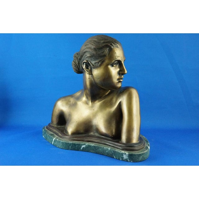 Weight of the sculpture: approximately 18.5 kg. Description of the object: Imposing bronze bust depicting a young naked...