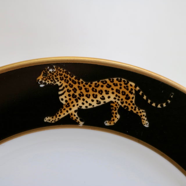 The Lynn Chase Designs Jaguar Jungle Bread & Butter Plates are a charming set of three round porcelain pieces, showcasing...