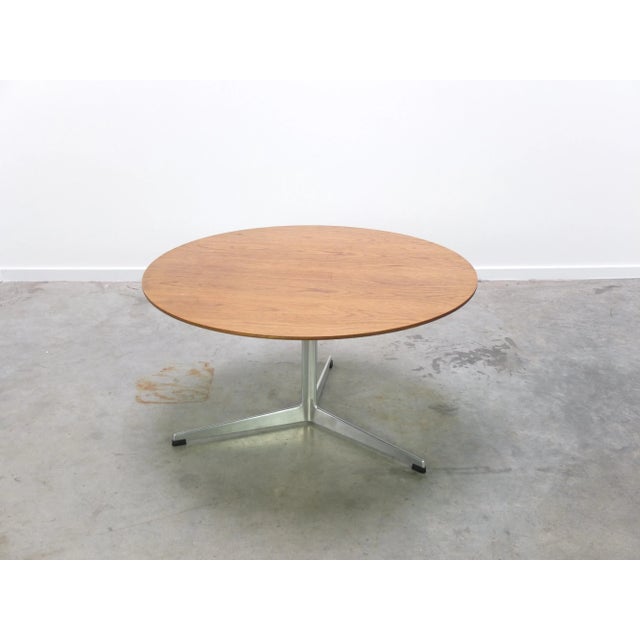 Magnificent circular coffee table designed by Arne Jacobsen the 1960s. The top is made of beautiful teak wood and rests on...
