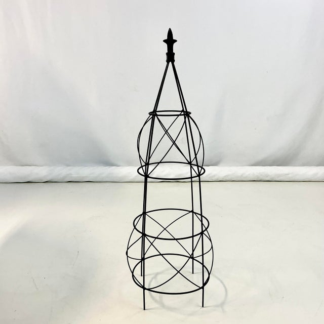 Offering a vintage French Garden Topiary Trellis Frame. It stands just over 3 feet tall with a design featuring criss-...