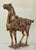 A wooden Tang Dynasty style wooden horse with gilded and polychrome finish. Finely carved in detail and expression. From...