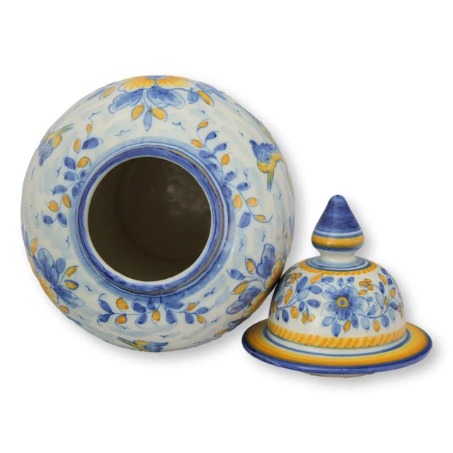 Oversized hand-painted ceramic ginger jar from Lisbon, Portugal, in vivid blue, ochre, and green. Likely produced in the...